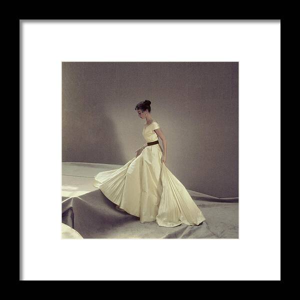 Fashion Framed Print featuring the photograph Model In A Jacques Griffe Gown by Henry Clarke