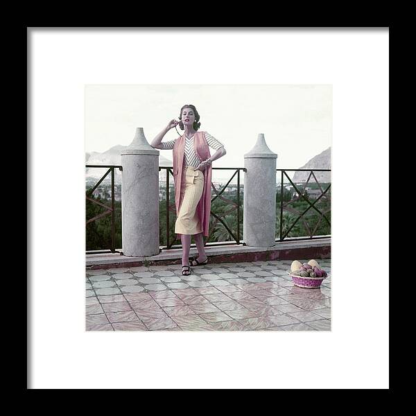Fashion Framed Print featuring the photograph Model In A Stanley Wyllins Ensemble by Henry Clarke