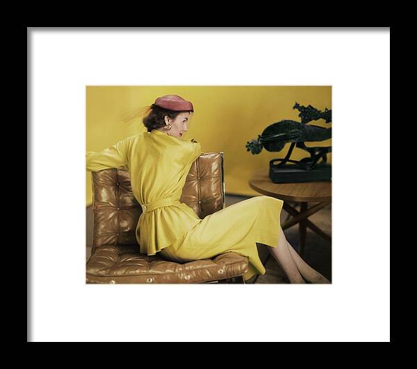 Beauty Framed Print featuring the photograph Model In A Yellow Dress Ensemble by Horst P. Horst