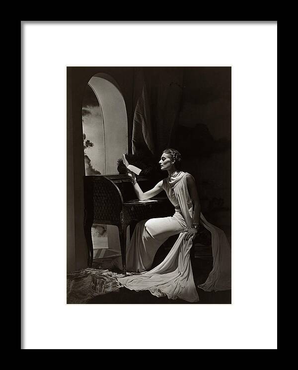 #new2022vogue Framed Print featuring the photograph Model Reading At A Roll-top Desk by Horst P Horst