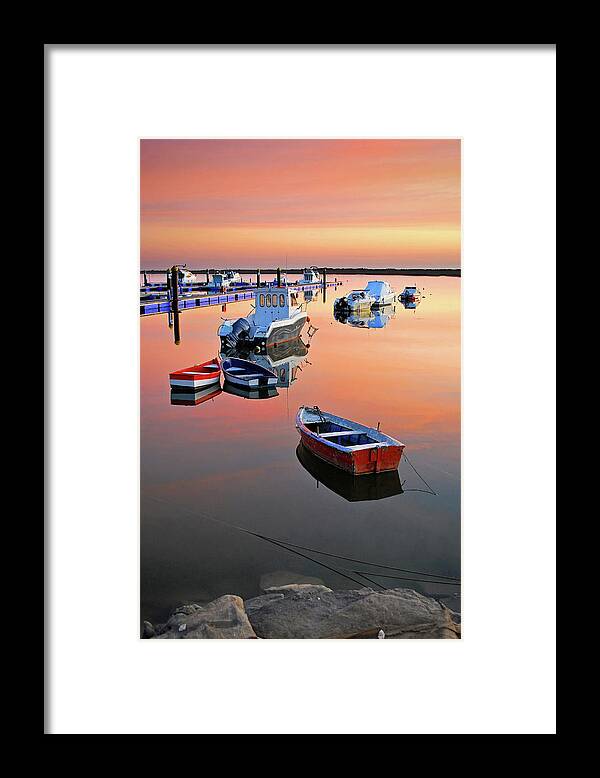 Scenics Framed Print featuring the photograph Moored Boats On Sea At Sunset by Juampiter