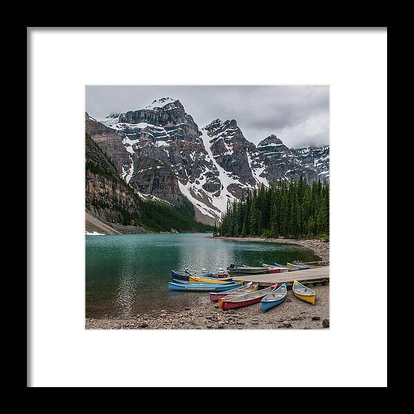 Tranquility Framed Print featuring the photograph Moraine Lake Canoes by Wr Mekwi
