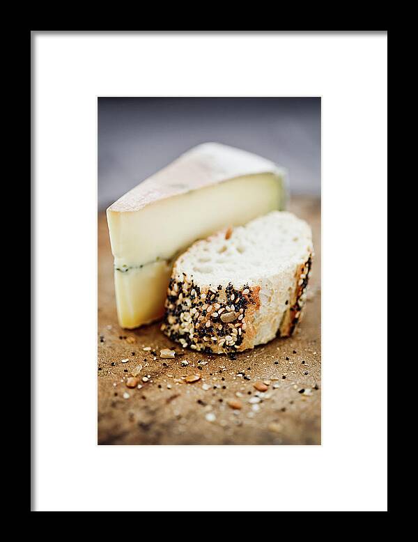 Aging Process Framed Print featuring the photograph Morbier Cheese On A Board With Seeded by Richard Boll
