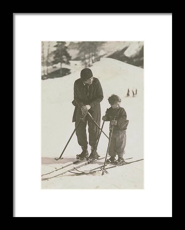 Skiing Framed Print featuring the photograph Mother And Son Skiing by Kurt Hutton