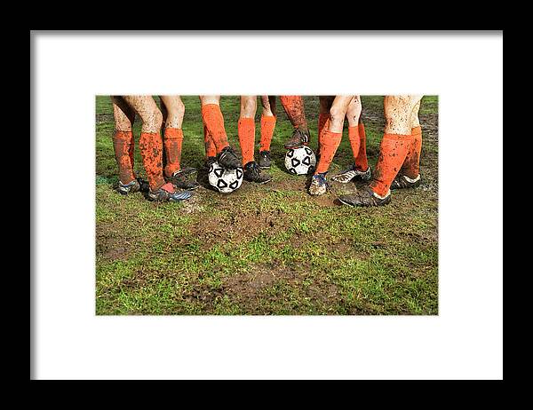 Soccer Uniform Framed Print featuring the photograph Muddy Legs Of Soccer Players by Jupiterimages