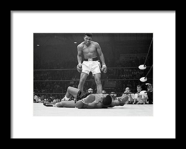 Heavyweight Framed Print featuring the photograph Muhammad Ali Taunting Sonny Liston by Bettmann