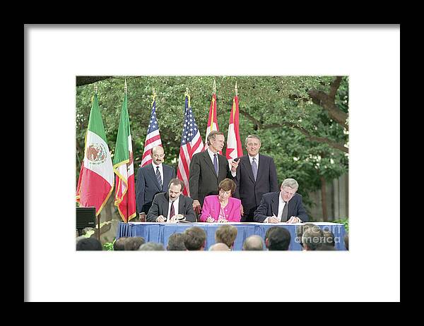 Trading Framed Print featuring the photograph Nafta Signing by Bettmann