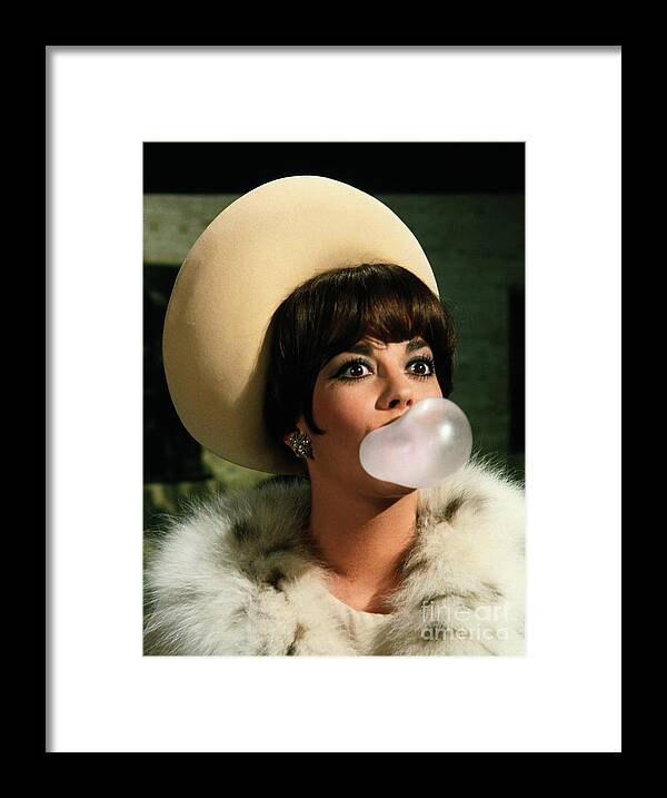 People Framed Print featuring the photograph Natalie Wood Blowing Bubble Gum Bubble by Bettmann