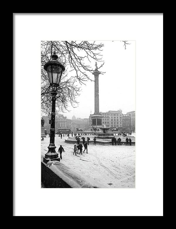 Nelson's Column Snow Framed Print featuring the photograph Nelson's Column Snow by Claire Doherty