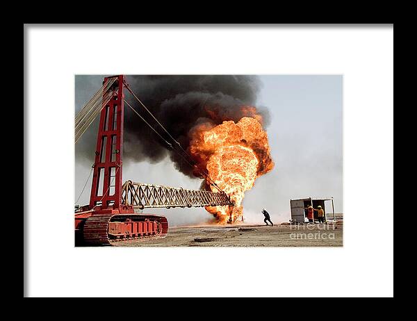Middle Eastern Framed Print featuring the photograph Oil Well Firefighting by Peter Menzel/science Photo Library