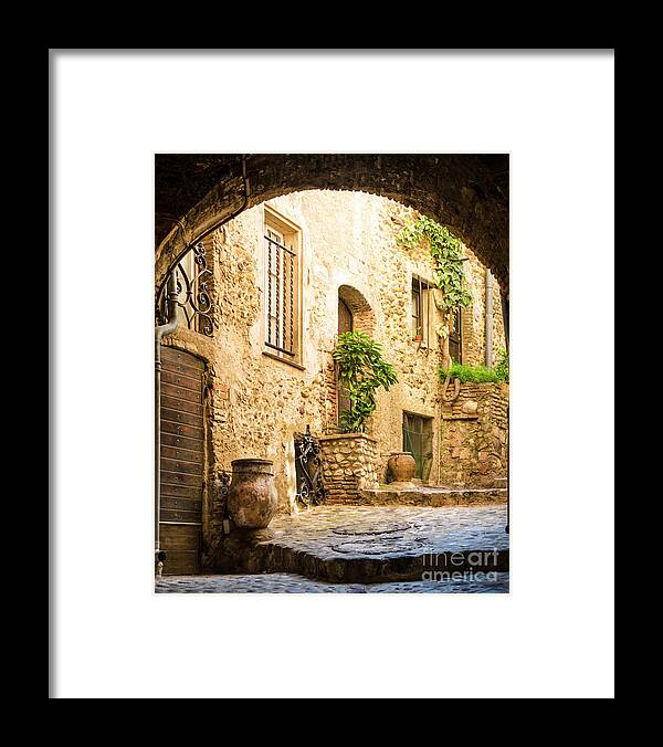 Arch Framed Print featuring the photograph Old Courtyard by Spooh