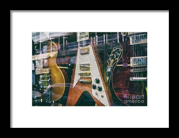 Old Guitars Framed Print featuring the photograph Old Guitars in a Shop Window by Tim Gainey
