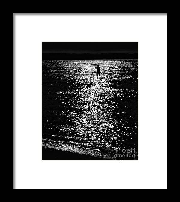 Paddleboarding Framed Print featuring the photograph Paddleboarding In Silhouette by Jeff Breiman