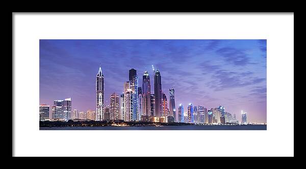 Panoramic Framed Print featuring the photograph Panoramic View Of Illuminated Dubai by Deejpilot