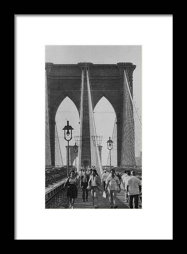 People Framed Print featuring the photograph People Walk Across The Brooklyn Bridge by New York Daily News Archive