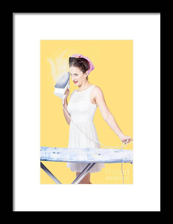 Cleaning Framed Print featuring the photograph Pin up woman providing steam clean ironing service by Jorgo Photography