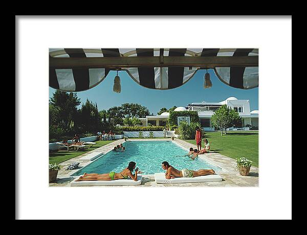 People Framed Print featuring the photograph Poolside In Sotogrande by Slim Aarons