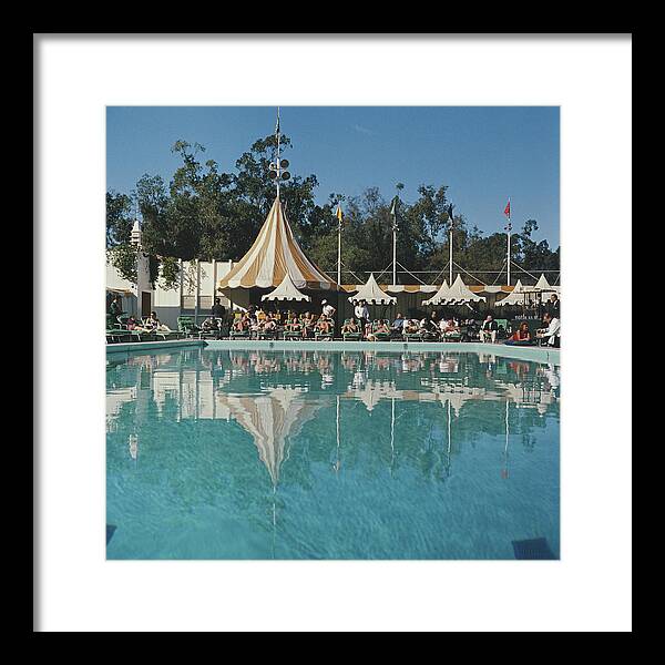 People Framed Print featuring the photograph Poolside Reflections by Slim Aarons