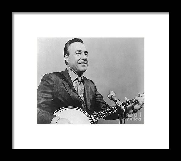 People Framed Print featuring the photograph Portrait Of Earl Scruggs Playing Banjo by Bettmann