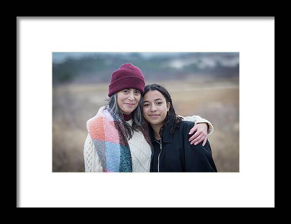 Mother And Daughter Framed Print featuring the photograph Portrait Of White Mother With Biracial Teen Daughter In Nature by Cavan Images / Julia Cumes