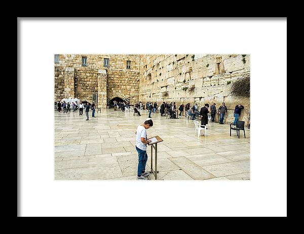 Western Wall Framed Print featuring the photograph Praying at the Western Wall by Roberta Kayne