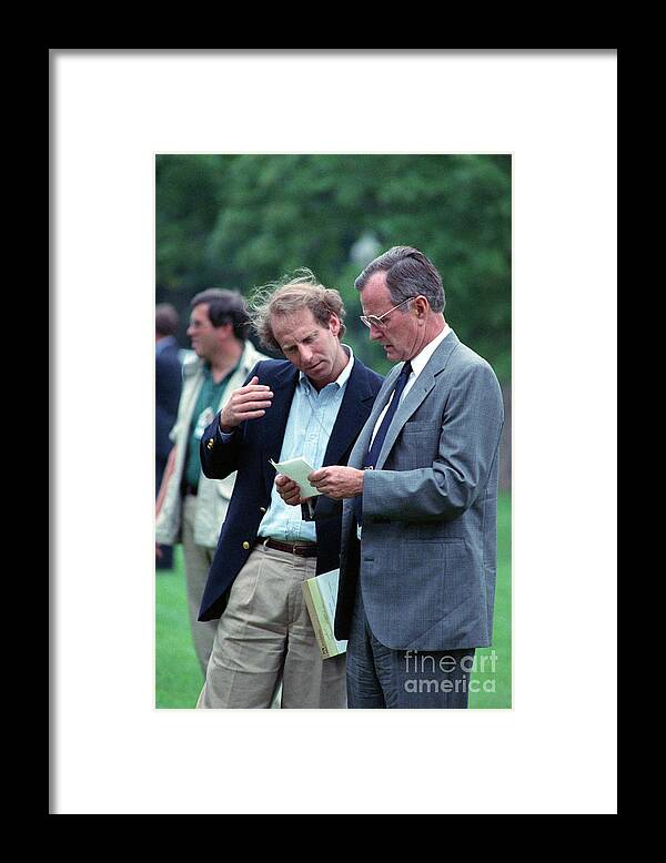 People Framed Print featuring the photograph Pres. Bush Handed Note By Assistant by Bettmann