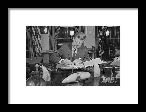 People Framed Print featuring the photograph President John F. Kennedy Signing by Bettmann