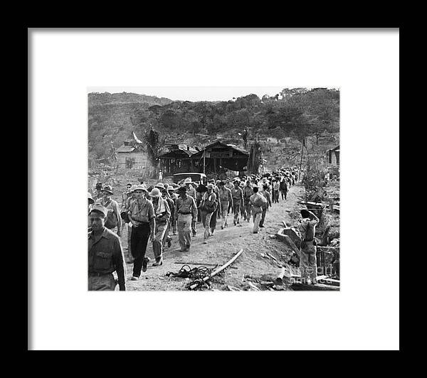 Marching Framed Print featuring the photograph Prisoners Along The Bataan Death March by Bettmann