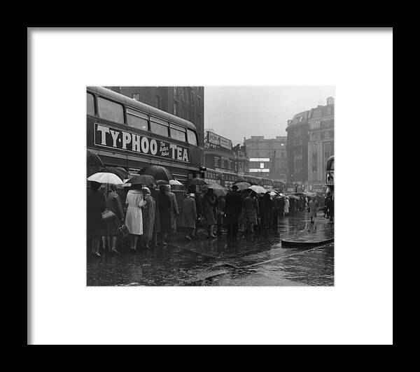 Crowd Framed Print featuring the photograph Queuing In Rain by Fox Photos