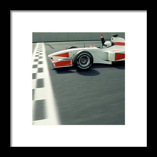 Aerodynamic Framed Print featuring the photograph Racing Driver Crossing Finishing Line by Alan Thornton