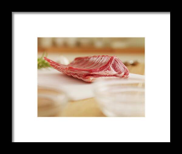 Cutting Board Framed Print featuring the photograph Raw Rack Of Lamb On Cutting Board by Adam Gault