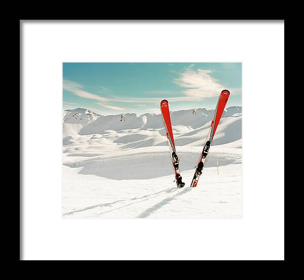 Scenics Framed Print featuring the photograph Red Pair Of Ski In Snow by Muriel De Seze
