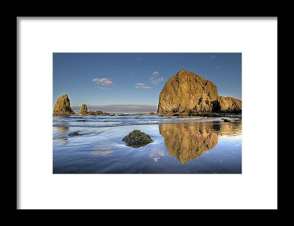 Tranquility Framed Print featuring the photograph Reflection Of Haystack Rock At Cannon by David Gn Photography