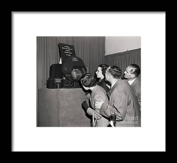 Puppet Show Framed Print featuring the photograph Reporters And Visitors Watch Color Tv by Bettmann