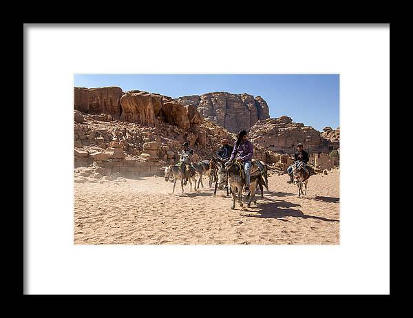 Donkeys Framed Print featuring the photograph Riding A Donkey by Zhd Bilgin