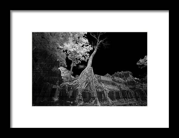 Ancient Framed Print featuring the photograph Ruins of Preak Khan in Cambodia in black and white infrared by Karen Foley