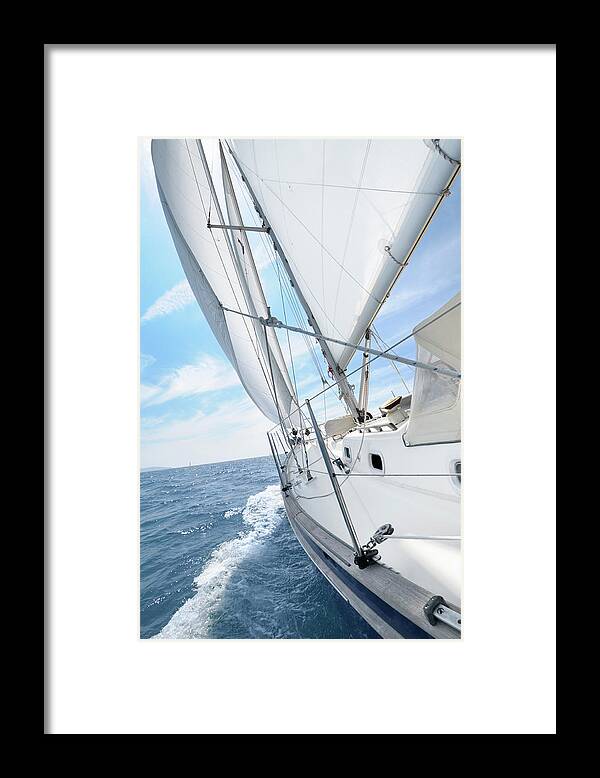 Eco Tourism Framed Print featuring the photograph Sailing Boat Under Sails Going Towars by Nikitje