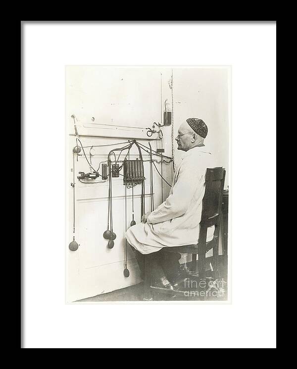 People Framed Print featuring the photograph Scientist Observing Recording Instrument by Bettmann