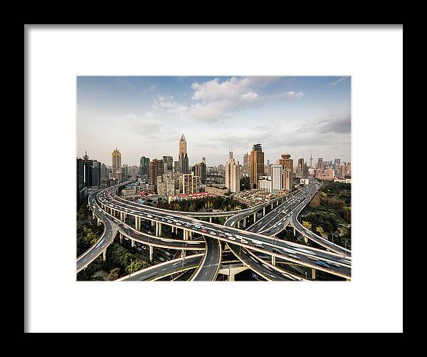 Built Structure Framed Print featuring the photograph Shanghai Skyline And Busy Road by Martin Puddy