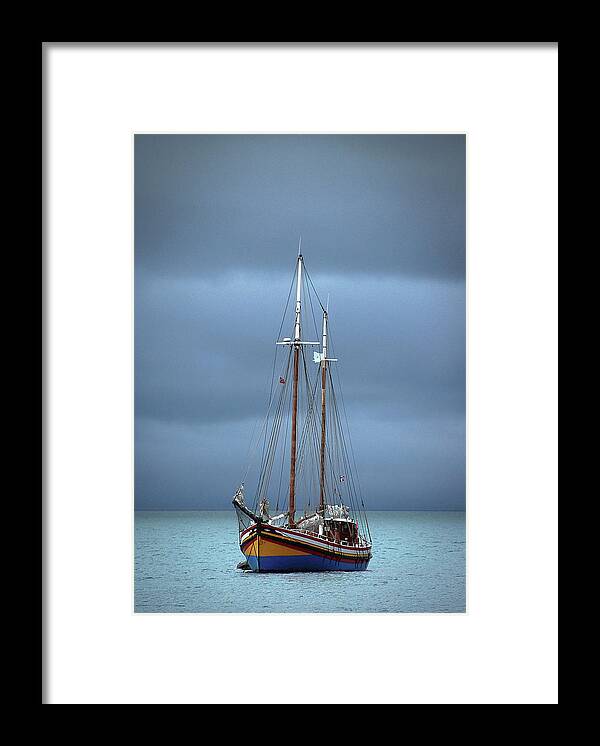 Tranquility Framed Print featuring the photograph Ship On The Ocean by Nancy Carels