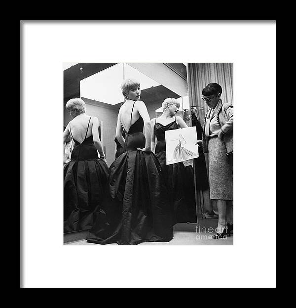 People Framed Print featuring the photograph Shirley Maclaine Trying On Gown by Bettmann