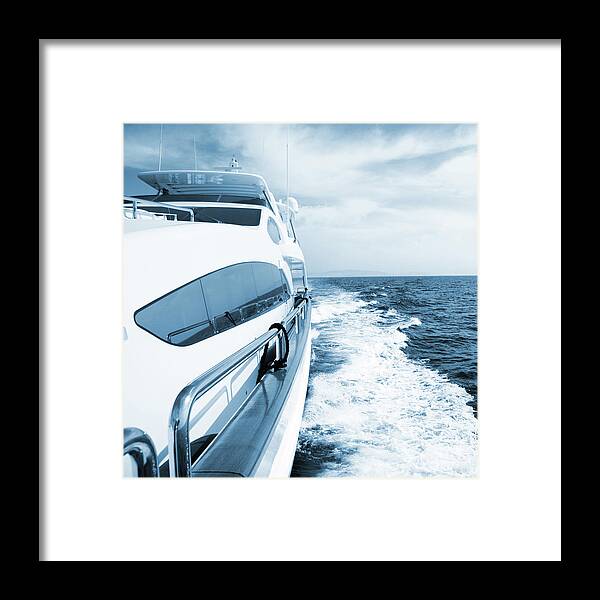 Desaturated Framed Print featuring the photograph Side View Of Luxury Yacht Sailing The by Petreplesea