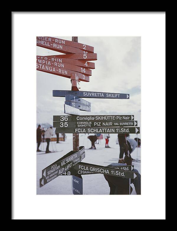 People Framed Print featuring the photograph Signpost In St. Moritz by Slim Aarons