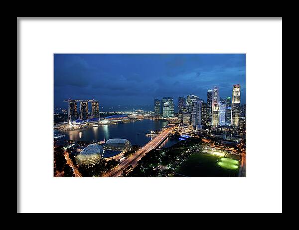 Southeast Asia Framed Print featuring the photograph Singapore City Skyline At Dusk by Raisbeckfoto