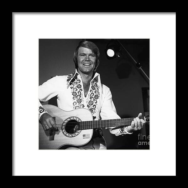 Singer Framed Print featuring the photograph Singer Glen Campbell Playing Guitar by Bettmann
