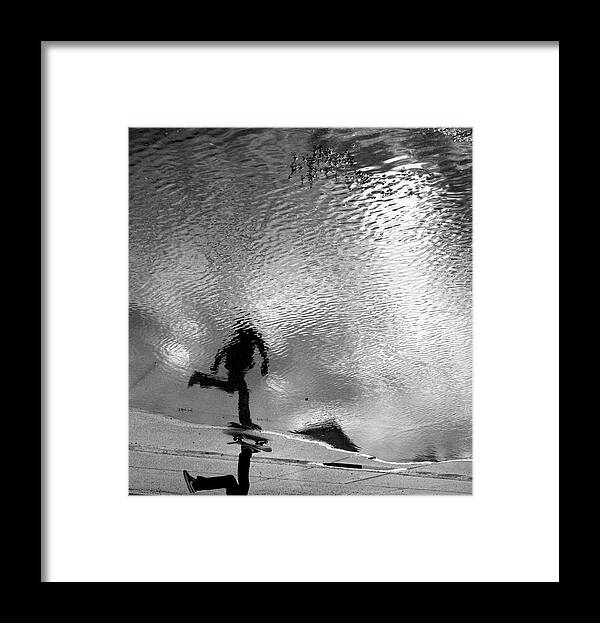 People Framed Print featuring the photograph Skateboarder Reflection In Puddle by Mgs