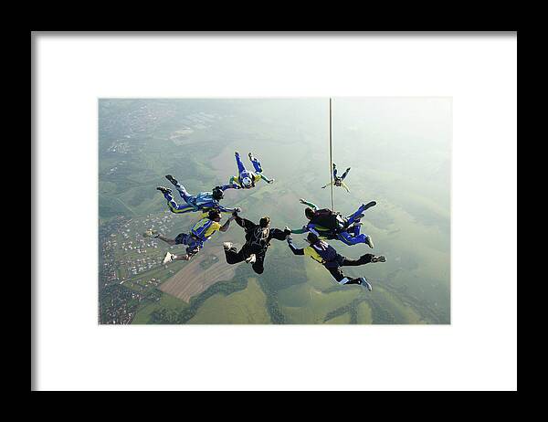 Parachuting Framed Print featuring the photograph Skydiving Tandem Formation Group by Graiki
