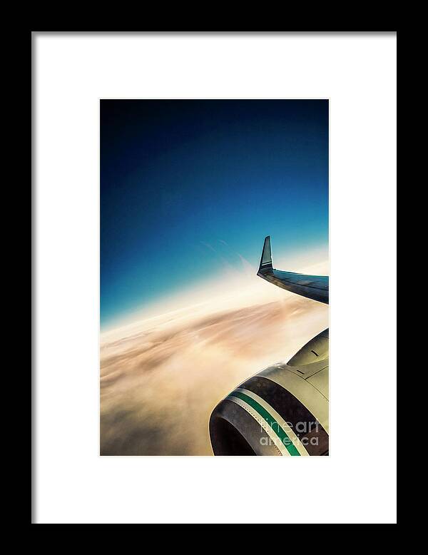 Amyn Nasser Framed Print featuring the photograph Sleek Jet Blue Sky Aerial by Neptune - Amyn Nasser Photographer