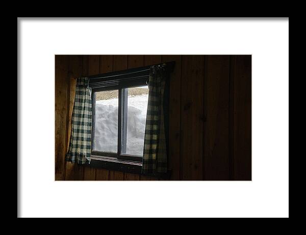 Snow Framed Print featuring the photograph Snow Packed Against A Wood Cabin Window As Seen From The Inside by Cavan Images