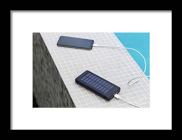 Smartphone Framed Print featuring the photograph Solar Smartphone Charger by Sakkmesterke/science Photo Library
